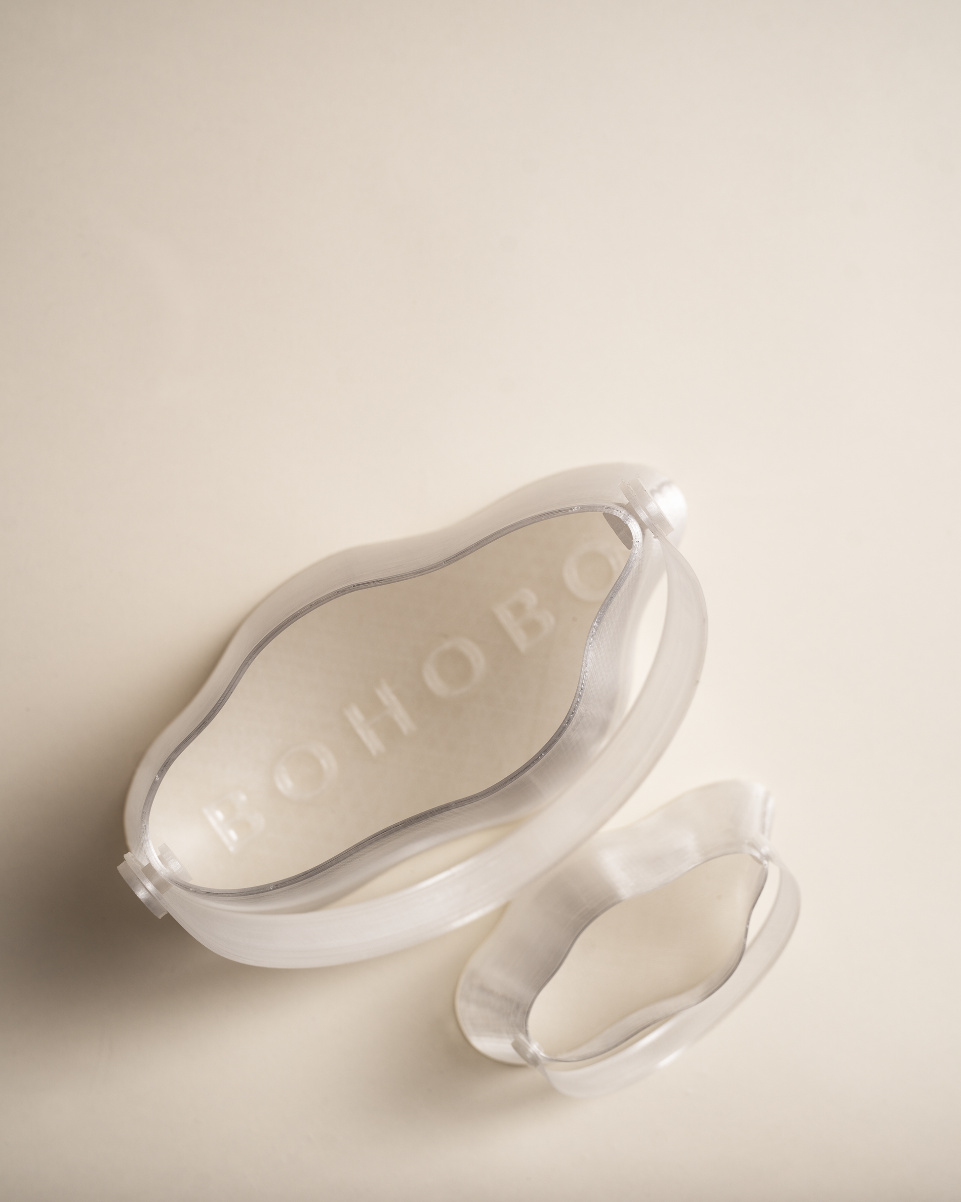 Shell Midi Bag in Ice, fully 3D-printed from recycled transparent TPU. Unique, edgy design with layered texture, combining sustainability and eco-conscious craftsmanship.