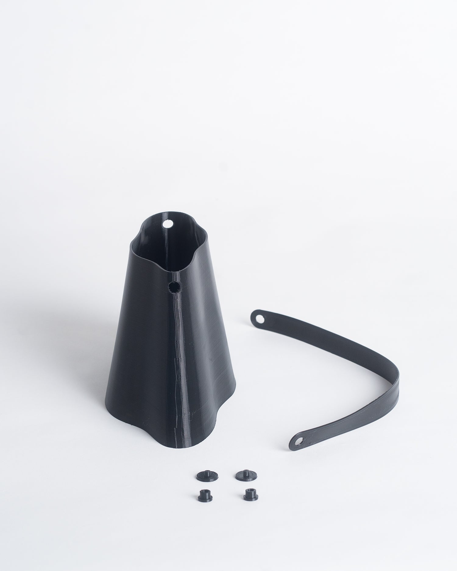 Shell Midi Bag in Charcoal, fully 3D-printed from recycled black TPU. Unique, edgy design with layered texture, combining sustainability and eco-conscious craftsmanship.