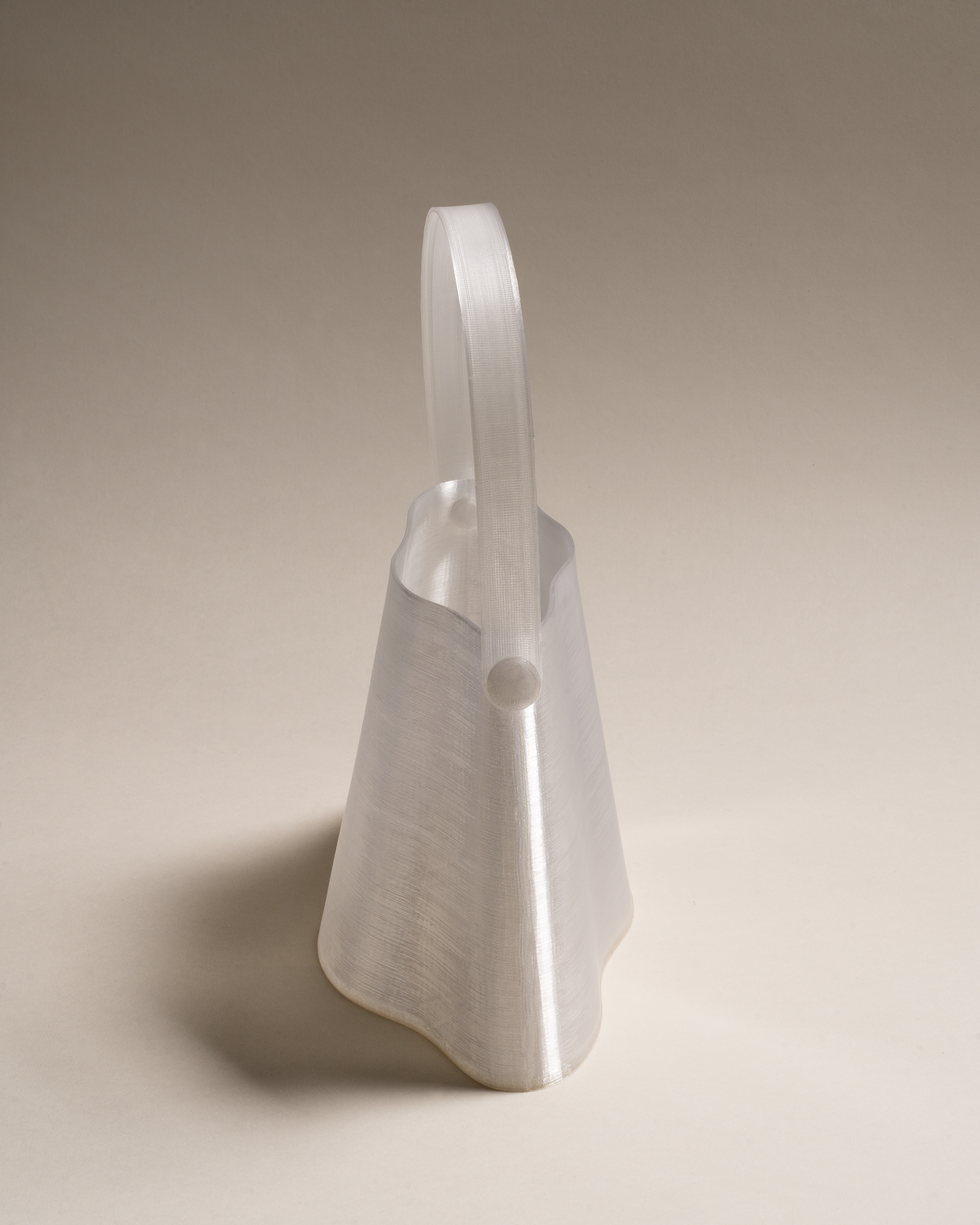 Shell Midi Bag in Ice, fully 3D-printed from recycled transparent TPU. Unique, edgy design with layered texture, combining sustainability and eco-conscious craftsmanship.