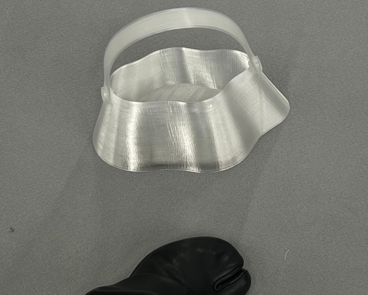 Shell Midi Bag in Ice, fully 3D-printed from recycled transparent TPU. Unique, edgy design with layered texture, combining sustainability and eco-conscious craftsmanship.