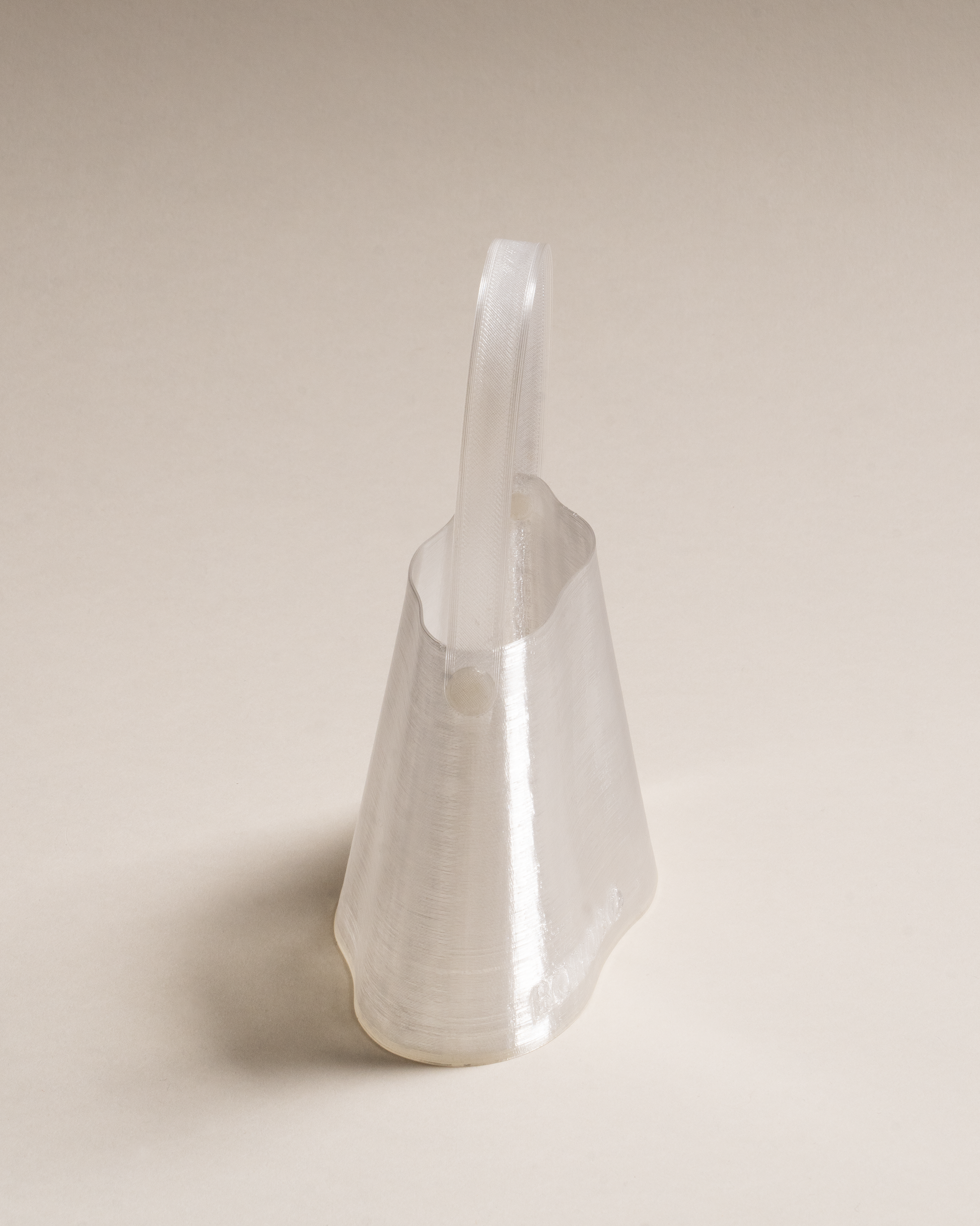 Shell Mini Bag, fully 3D-printed from recycled transparent TPU. Unique layered design, compact yet striking, combining sustainability and innovative craftsmanship.