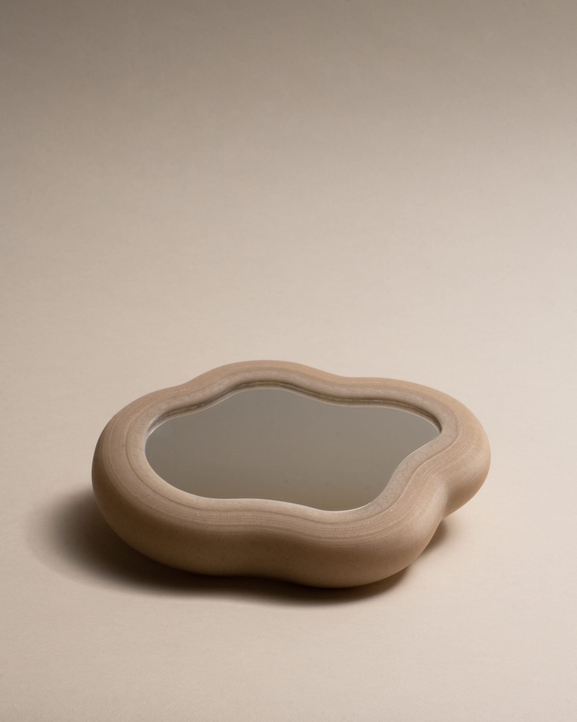 Blob Mirror, 3D-printed from eco-friendly PLA filaments mixed with natural by-products like oyster, mussel, scallop shells and wheat offcuts. Unique organic shape, versatile as a hand mirror or chic tray, with sustainable, non-toxic craftsmanship.