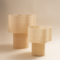 Collection of Cloudy Lamps in various earthy colors, 3D-printed from PLA filaments mixed with natural by-products like mussel shells, oysters, scallops, and wheat offcuts. Eco-friendly, with unique textures and colors created through recycling waste from agriculture and catering. Provides ambient, decorative light.