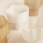 Collection of Cloudy Lamps in various earthy colors, 3D-printed from PLA filaments mixed with natural by-products like mussel shells, oysters, scallops, and wheat offcuts. Eco-friendly, with unique textures and colors created through recycling waste from agriculture and catering. Provides ambient, decorative light.