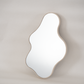 Muffin Top Mirror, inspired by the natural curves of the female body. Handcrafted from eco-friendly Jesmonite, this versatile piece functions as a mirror, tray, or sculpture. Each unique piece has its own subtle variations, reflecting sustainable craftsmanship.